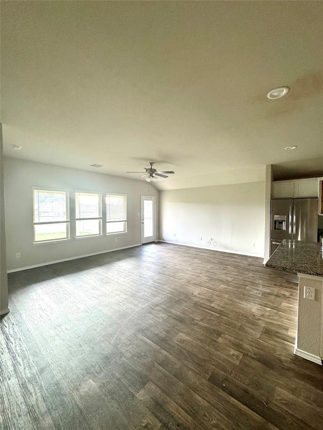 13909 Payette Arbor Ct, Conroe, TX 77384 - unfurnished living room featuring dark wood-type flooring, ceiling fan, baseboards, and recessed lighting