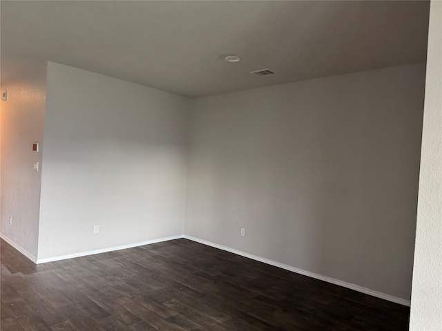 13909 Payette Arbor Ct, Conroe, TX 77384 - unfurnished room with dark wood finished floors and baseboards