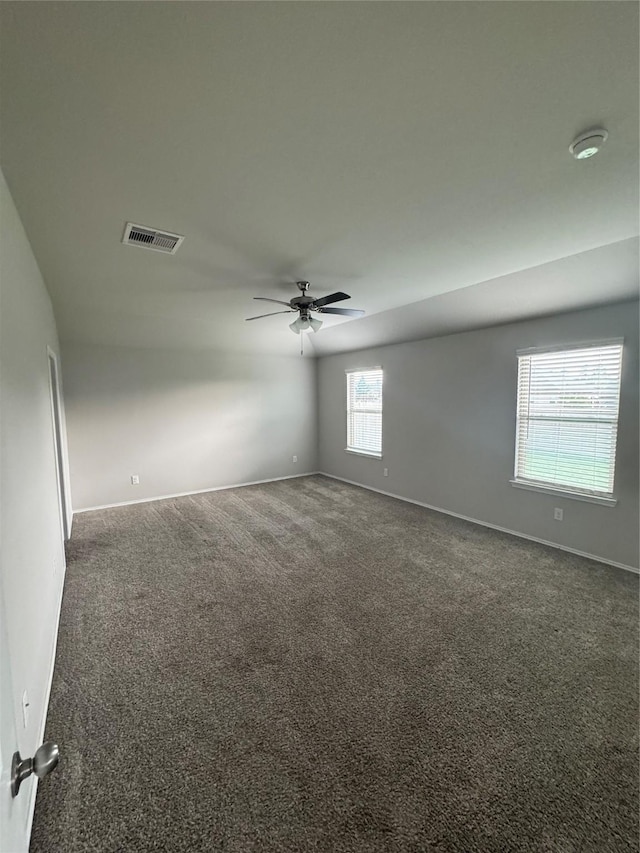 13909 Payette Arbor Ct, Conroe, TX 77384 - spare room with ceiling fan, baseboards, and dark carpet