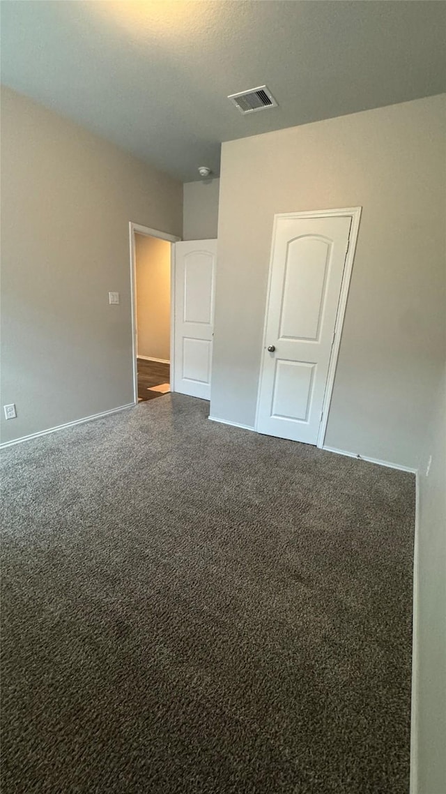 13909 Payette Arbor Ct, Conroe, TX 77384 - unfurnished bedroom with carpet and baseboards