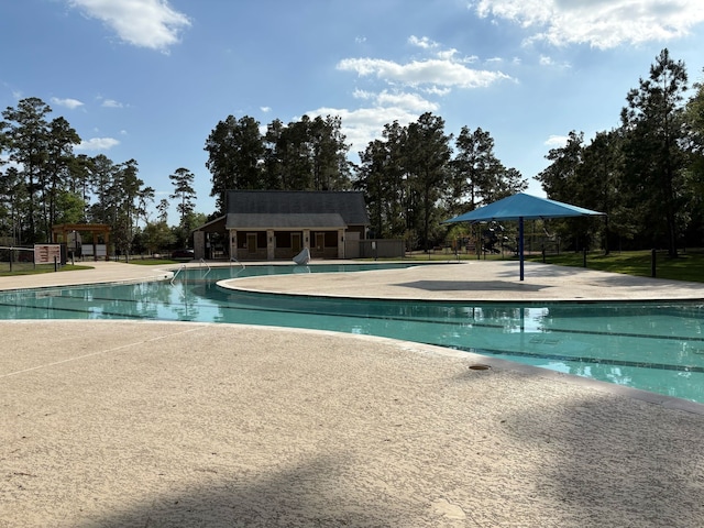 13909 Payette Arbor Ct, Conroe, TX 77384 - community pool featuring a patio