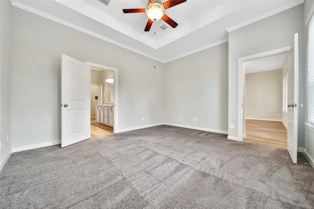117 Saddle Dr, Houston, TX 77065 - unfurnished bedroom with carpet floors, baseboards, a raised ceiling, and ornamental molding