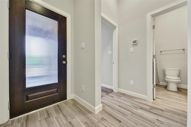 117 Saddle Dr, Houston, TX 77065 - entrance foyer with wood tiled floors and baseboards