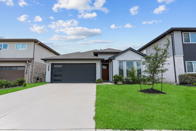 7414 Keystone Blossom Trl, Richmond, TX 77407 - view of front of house with a garage, concrete driveway, a front yard, and brick siding