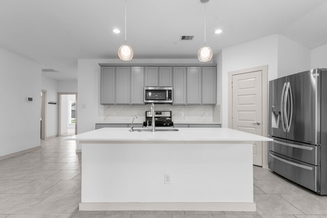 7414 Keystone Blossom Trl, Richmond, TX 77407 - kitchen featuring stainless steel appliances, gray cabinets, light countertops, tasteful backsplash, and recessed lighting