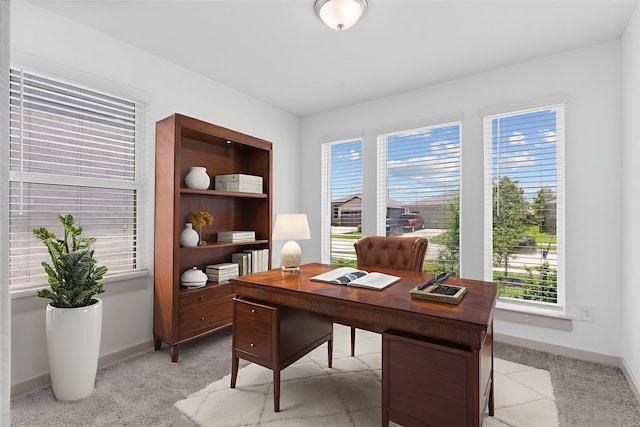 7414 Keystone Blossom Trl, Richmond, TX 77407 - office area with light carpet, plenty of natural light, and baseboards