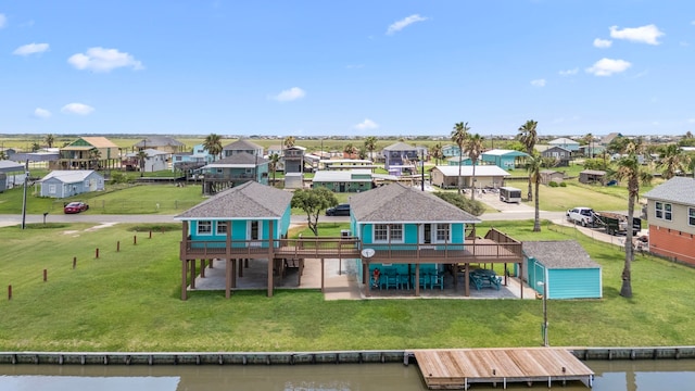 621 County Road 202, Sargent, TX 77414 - rear view of property featuring a residential view, a deck with water view, and a lawn