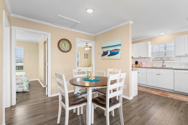 621 County Road 202, Sargent, TX 77414 - dining room with dark wood-style floors, ornamental molding, baseboards, and recessed lighting