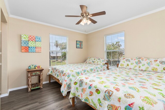 621 County Road 202, Sargent, TX 77414 - bedroom with wood finished floors, crown molding, baseboards, and ceiling fan
