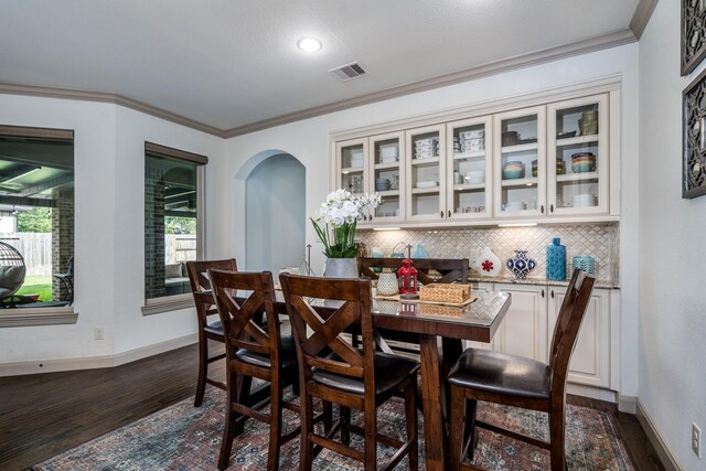 18815 Ellis Bend Dr, Cypress, TX 77433 - dining room with dark wood-style floors, baseboards, ornamental molding, and recessed lighting