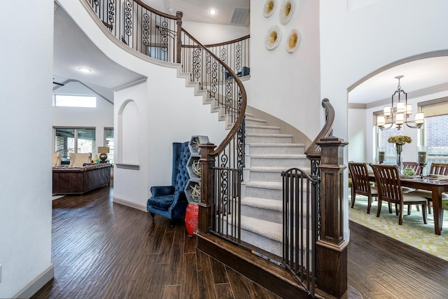 18815 Ellis Bend Dr, Cypress, TX 77433 - staircase featuring wood finished floors, healthy amount of natural light, baseboards, a chandelier, and a high ceiling