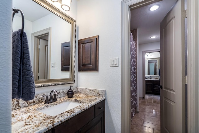 18815 Ellis Bend Dr, Cypress, TX 77433 - full bathroom featuring vanity, marble finish floors, and recessed lighting