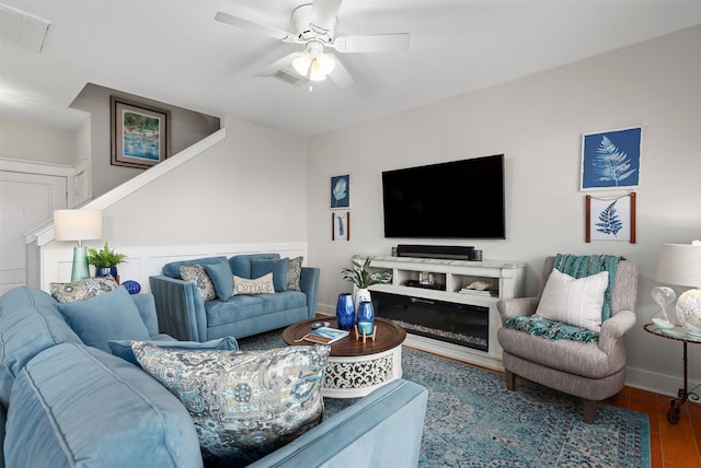 4123 King Rail Cir, Galveston, TX 77554 - living room with wood finished floors, a ceiling fan, and baseboards