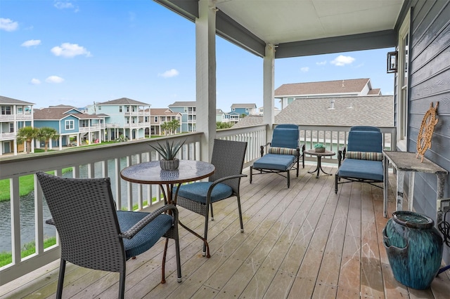 4123 King Rail Cir, Galveston, TX 77554 - wooden terrace with a residential view and a water view