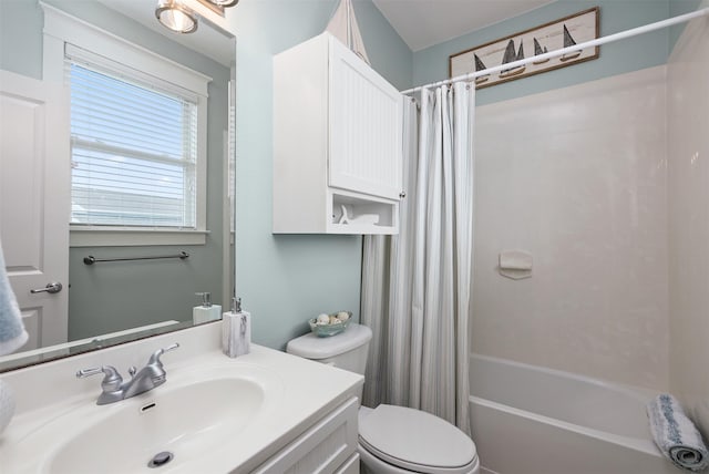 4123 King Rail Cir, Galveston, TX 77554 - bathroom featuring toilet, vanity, and shower / bath combo with shower curtain
