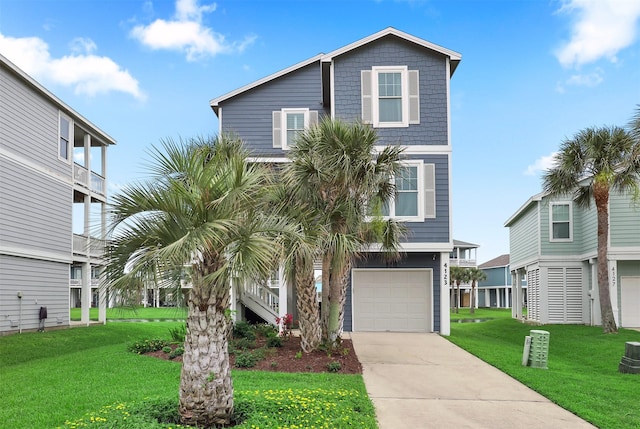 4123 King Rail Cir, Galveston, TX 77554 - coastal inspired home with a garage, concrete driveway, and a front lawn