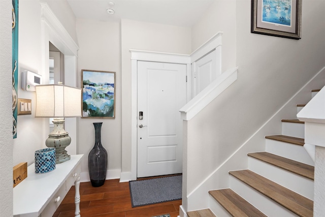 4123 King Rail Cir, Galveston, TX 77554 - foyer featuring wood finished floors, stairway, and baseboards