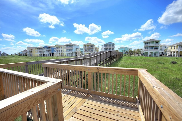 4123 King Rail Cir, Galveston, TX 77554 - wooden terrace featuring a residential view and a yard