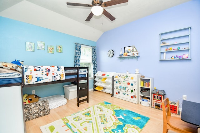 2818 Lakecrest Forest Dr, Katy, TX 77493 - bedroom with wood finished floors, vaulted ceiling, and ceiling fan