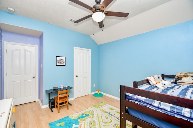 2818 Lakecrest Forest Dr, Katy, TX 77493 - bedroom with light wood finished floors, lofted ceiling, baseboards, and a ceiling fan