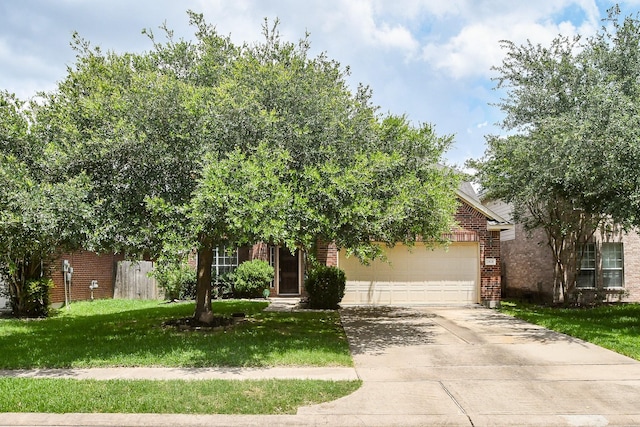 2818 Lakecrest Forest Dr, Katy, TX 77493 - view of property hidden behind natural elements with brick siding, a garage, and concrete driveway