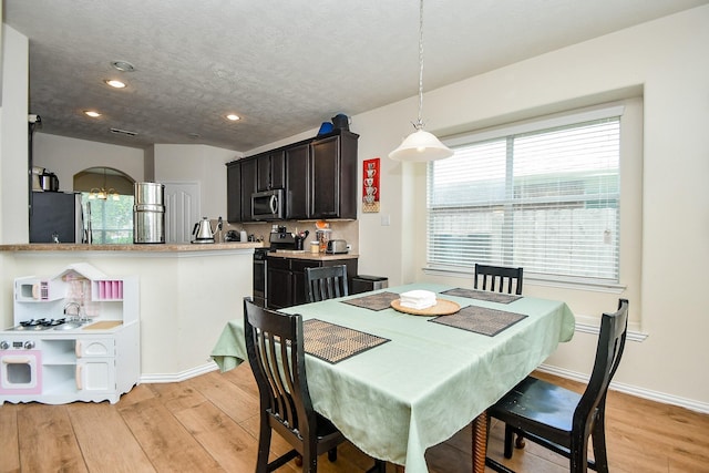 2818 Lakecrest Forest Dr, Katy, TX 77493 - dining area with light wood-style flooring, healthy amount of natural light, recessed lighting, and baseboards