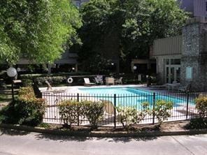 2207 S Braeswood Blvd S Unit 43B, Houston, TX 77030 - community pool featuring a patio area