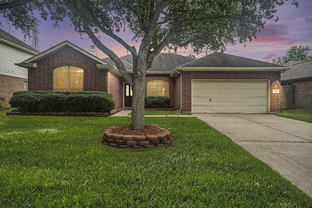 312 Cedar Branch Dr, League City, TX 77573 - ranch-style home with brick siding, an attached garage, concrete driveway, and a lawn