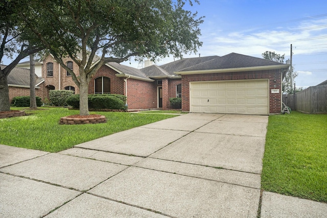 312 Cedar Branch Dr, League City, TX 77573 - ranch-style house with concrete driveway, brick siding, an attached garage, and a shingled roof