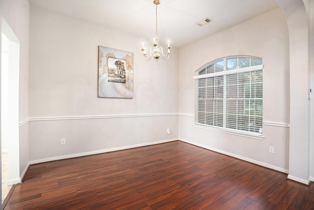 312 Cedar Branch Dr, League City, TX 77573 - spare room featuring a chandelier, wood finished floors, and arched walkways