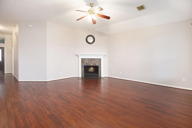 312 Cedar Branch Dr, League City, TX 77573 - unfurnished living room with ceiling fan, dark wood-style flooring, and a tile fireplace