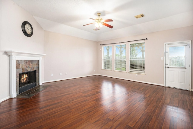 312 Cedar Branch Dr, League City, TX 77573 - unfurnished living room featuring a ceiling fan, dark wood-type flooring, and a tile fireplace