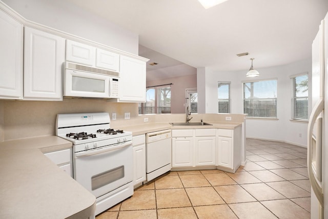 312 Cedar Branch Dr, League City, TX 77573 - kitchen featuring white appliances, a peninsula, white cabinetry, and light countertops