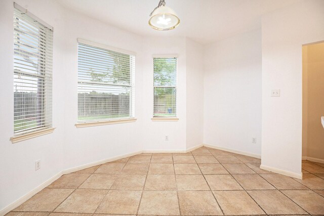 312 Cedar Branch Dr, League City, TX 77573 - empty room featuring light tile patterned flooring and baseboards