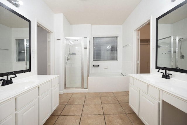 312 Cedar Branch Dr, League City, TX 77573 - full bath featuring a shower stall, two vanities, a bath, and tile patterned flooring