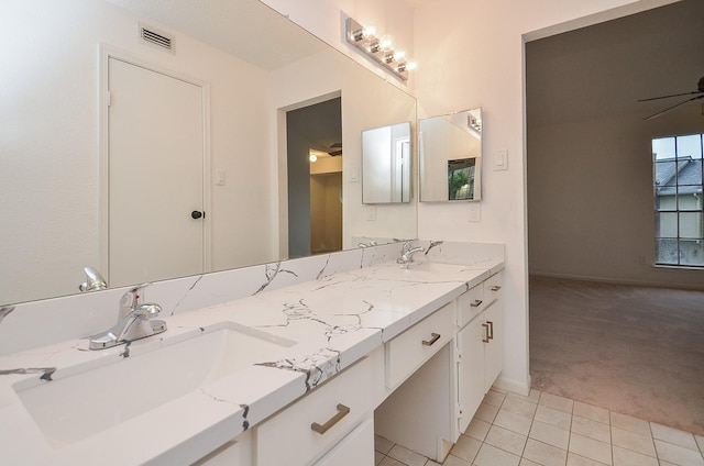 11201 Lynbrook Dr Unit 2903, Houston, TX 77042 - bathroom featuring double vanity, tile patterned floors, baseboards, and ceiling fan