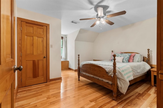 19314 Indigo Lake Dr, Magnolia, TX 77355 - bedroom with light wood-style flooring, baseboards, a ceiling fan, and vaulted ceiling