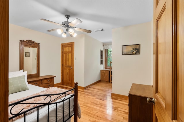 19314 Indigo Lake Dr, Magnolia, TX 77355 - bedroom featuring light wood-style floors, baseboards, and a ceiling fan