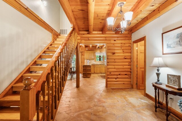 19314 Indigo Lake Dr, Magnolia, TX 77355 - hall with rustic walls, wood ceiling with exposed beams, a chandelier, light stone finish flooring, and stairway