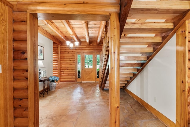 19314 Indigo Lake Dr, Magnolia, TX 77355 - foyer entrance featuring wood ceiling with exposed beams, stairs, baseboards, and log walls