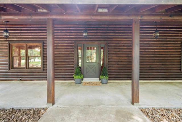 19314 Indigo Lake Dr, Magnolia, TX 77355 - entrance to property featuring a porch and log veneer siding