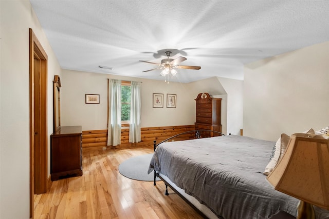 19314 Indigo Lake Dr, Magnolia, TX 77355 - bedroom featuring light wood-type flooring, ceiling fan, and a textured ceiling