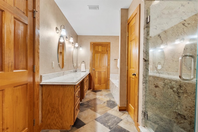 19314 Indigo Lake Dr, Magnolia, TX 77355 - full bath with vanity, a garden tub, and a stall shower