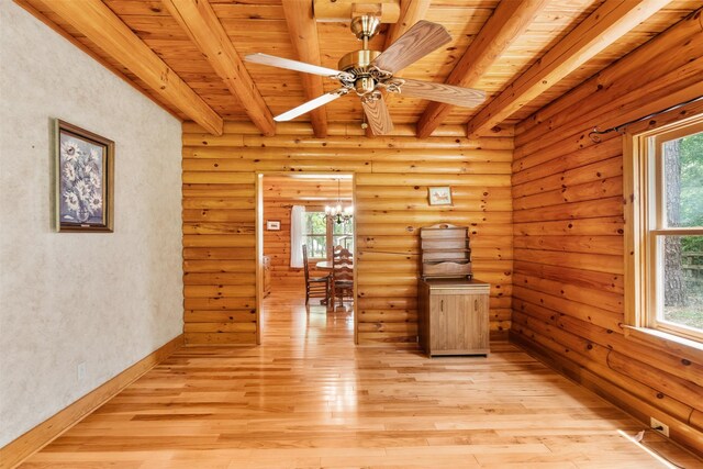 19314 Indigo Lake Dr, Magnolia, TX 77355 - empty room with wooden ceiling with exposed beams, light wood-type flooring, a ceiling fan, a chandelier, and baseboards