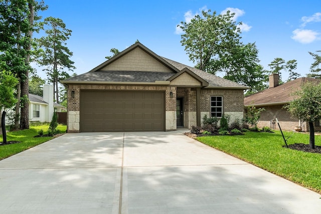 12219 Browning Dr, Montgomery, TX 77356 - view of front of home with brick siding, an attached garage, driveway, a front yard, and a shingled roof
