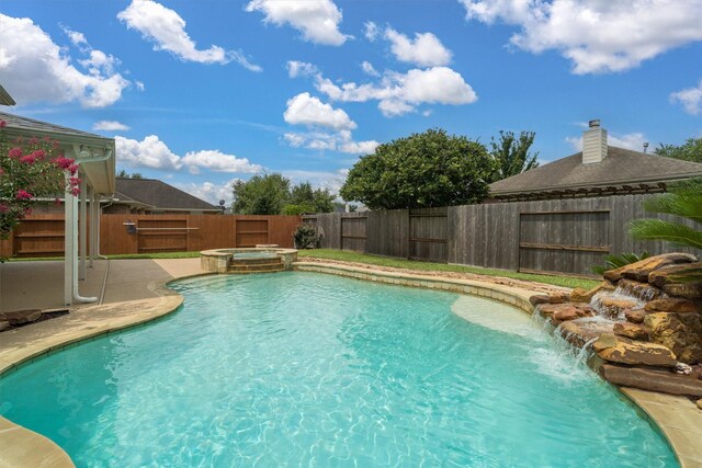 2113 Midway Ct, League City, TX 77573 - view of pool with a fenced backyard, a pool with connected hot tub, and a patio