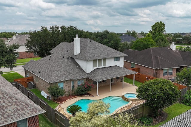 2113 Midway Ct, League City, TX 77573 - view of swimming pool featuring a fenced backyard, a patio area, and a pool with connected hot tub