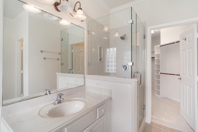 2113 Midway Ct, League City, TX 77573 - full bath with a stall shower, a walk in closet, vanity, crown molding, and tile patterned floors