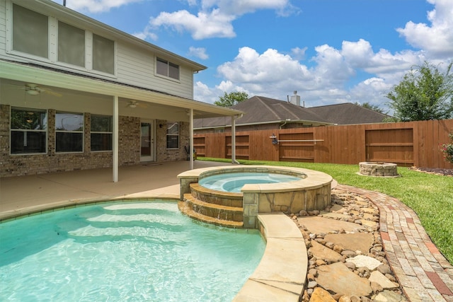 2113 Midway Ct, League City, TX 77573 - view of swimming pool featuring a fenced backyard, a ceiling fan, a fire pit, a patio, and a pool with connected hot tub