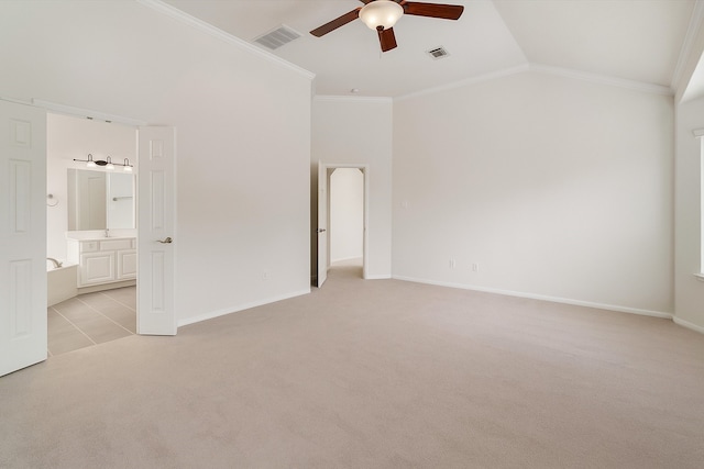 2113 Midway Ct, League City, TX 77573 - unfurnished bedroom featuring light colored carpet, ornamental molding, lofted ceiling, ensuite bathroom, and baseboards